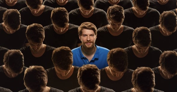 A man stands out in the crowd, representing successful personal branding.