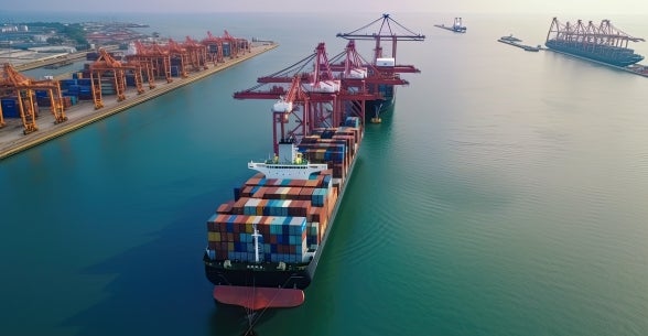 Port with cargo ship and ocean