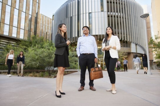 Thunderbird students stand outside its new global headquarters in Phoenix