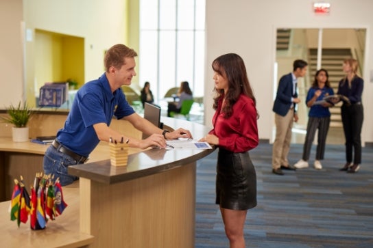 Thunderbird staff greet a visitor on the second floor reception area