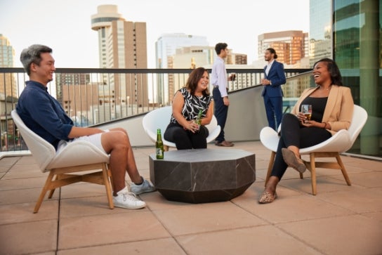 Thunderbird students socialize on the roof-top deck of the Pub