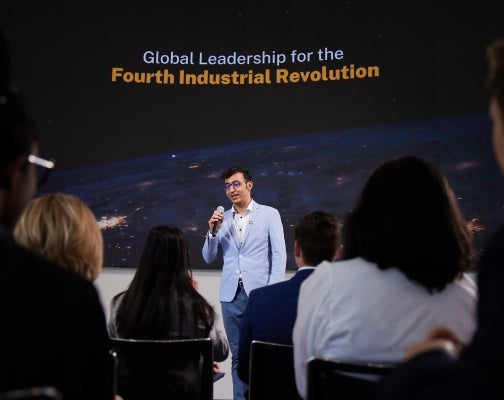 A Thunderbird student presents at an event in the global forum